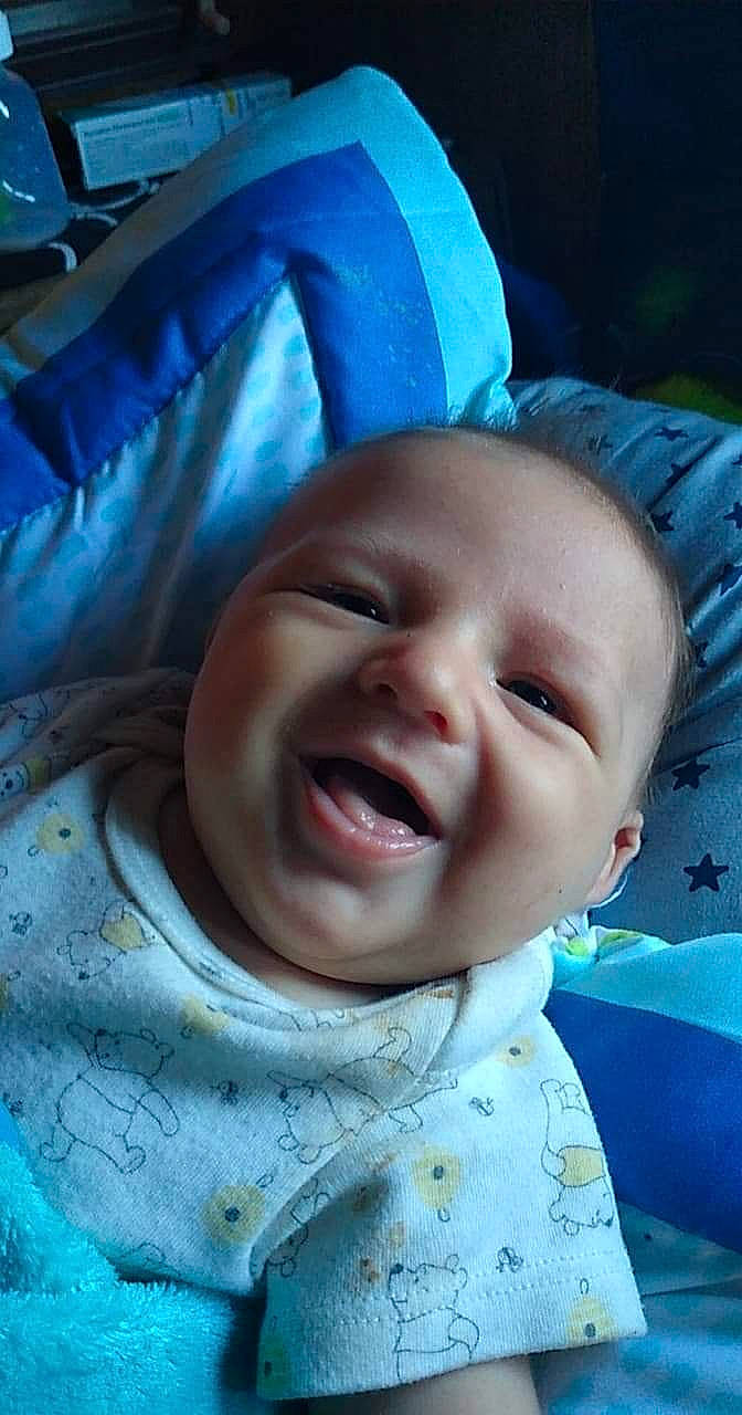 Bjorn is registered to the contest to win money with this photo: baby, baby_toddler_clothing, blue, cheek, chin, eye, eyebrow, facial_expression, happy, iris, jaw, lip, mouth, nose, person, photograph, product, skin, smile, textile