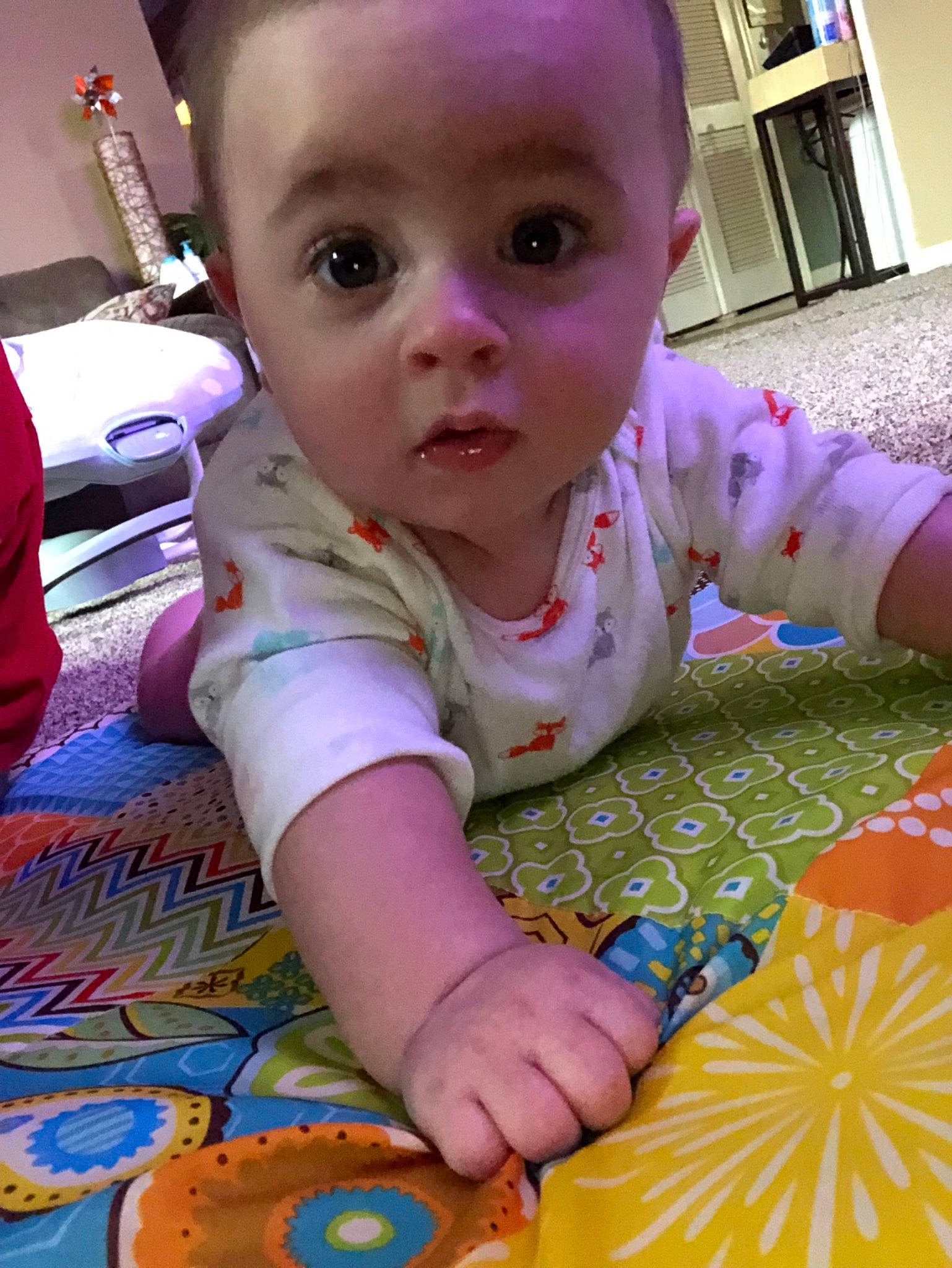 Dustin is registered to the contest to win money with this photo: baby, baby_products, baby_toys, cheek, child, person, play, sitting, surprise, toddler, toy, tummy_time