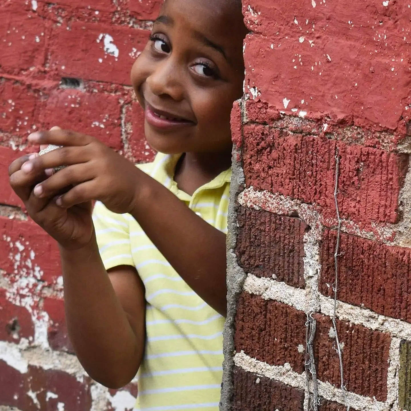 Camden is registered to the contest to win money with this photo: beauty, brick, brickwork, child, fun, happy, joy, laugh, leisure, magenta, pattern, people_in_nature, person, portrait_photography, red, sitting, smile, soil, temple, textile