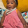 Kennedi joined the competition — help win amazing prizes! baby, child, infant, headband, bow, pink_striped_dress, curly_hair, cushion, yellow, blanket, indoors, portrait, cute, smiling, happy, person, sitting, clothing, closeup, baby_accessory