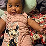 baby, infant, child, smile, pink_clothing, minnie_mouse, headband, blanket, pillow, cute, portrait, indoors, cozy, happy, plush, person, toddler, closeup, soft_texture, warm
