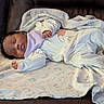 baby, bib, blanket, child, comfort, couch, cozy, cute, indoors, infant, leather, newborn, pajamas, peaceful, portrait, relaxation, resting, sleeping, soft, young