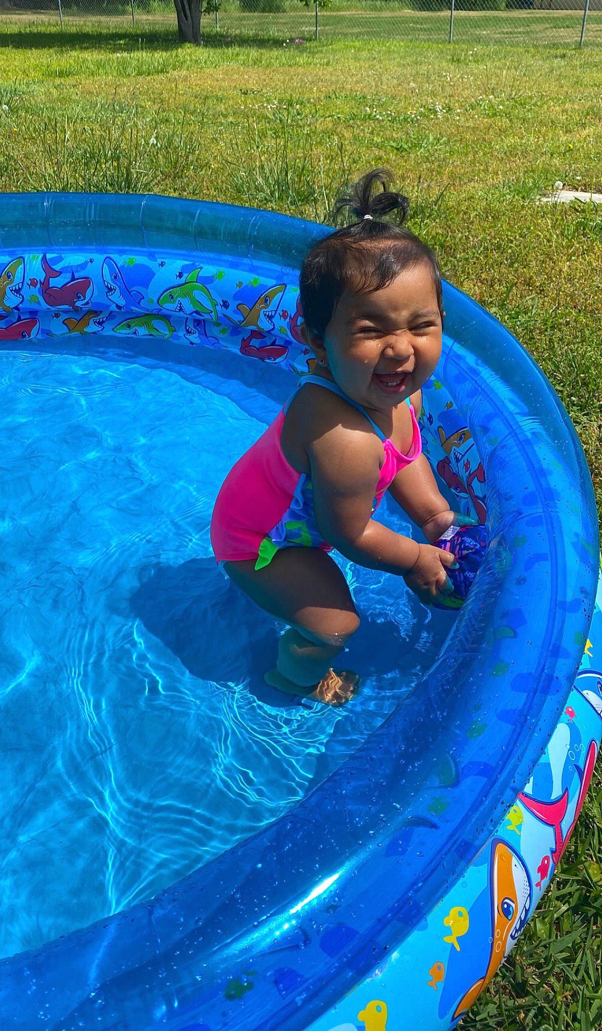 Elena joined the competition — help win amazing prizes! aqua, baby, baby_toddler_clothing, bathing, blue, child, electric_blue, fun, grass, happy, leisure, nonbuilding_structure, outdoor_recreation, person, plant, play, recreation, smile, swimming_pool, toddler