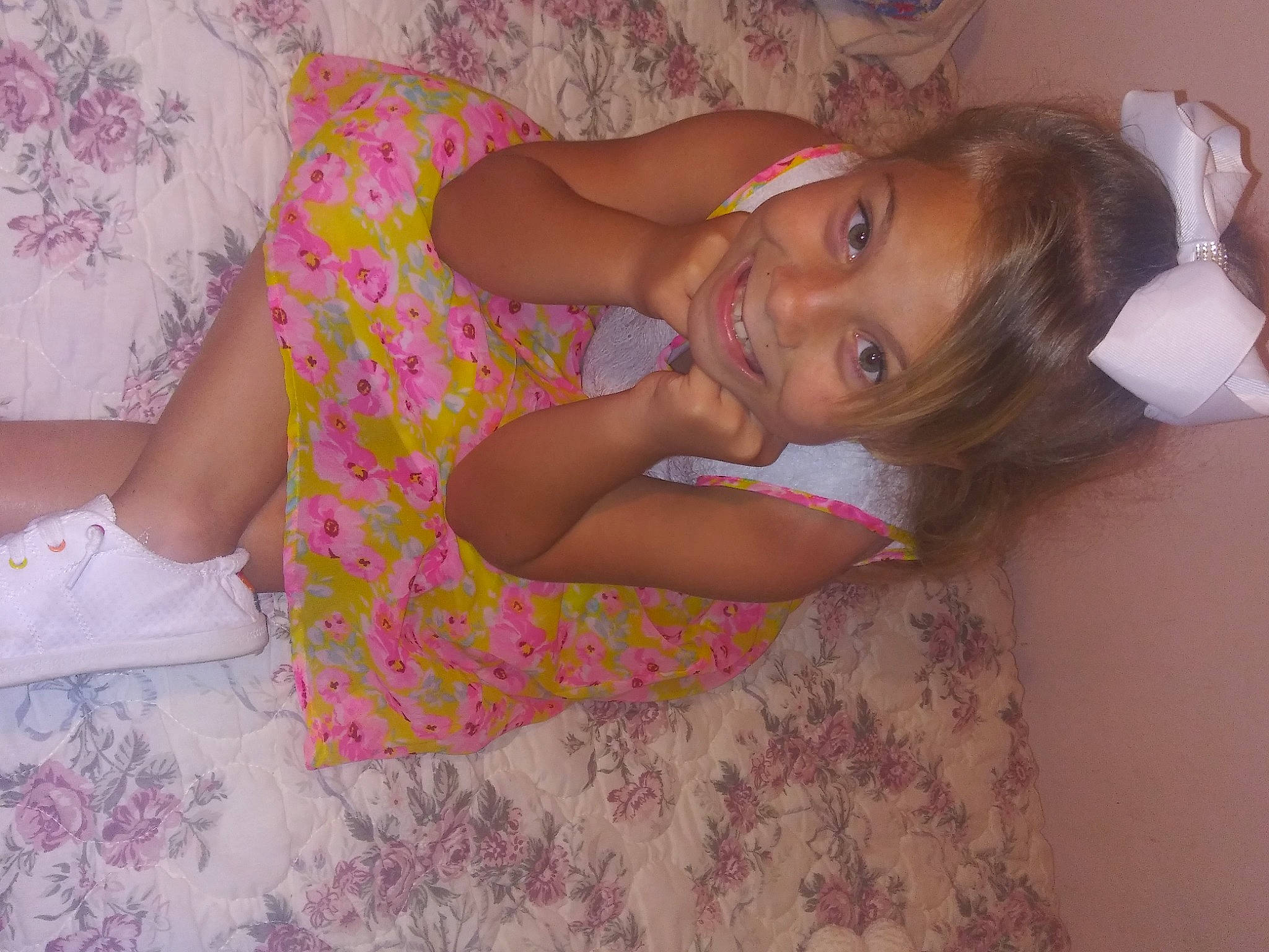 Peyton is registered to the contest to win money with this photo: comfort, elbow, eyelash, fun, hand, happy, human_body, human_leg, joint, joy, linens, long_hair, mouth, nail, nose, person, pink, skin, smile, thigh