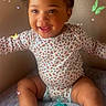 baby, child, smiling, indoor, onesie, socks, pigtails, pacifier, bed, patterned_clothing, cute, happy, skin, wall, butterfly_overlay, digital_effects, infant, young_child, sitting, playful