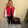 Kimberley a rejoint le concours — aidez-le/la à gagner de superbes lots ! backpack, black_clothing, casual_wear, child, cute, footwear, girl, glasses, home, indoor, person, ready, red_jacket, school_bag, shadow, smile, standing, tile_floor, wall, young