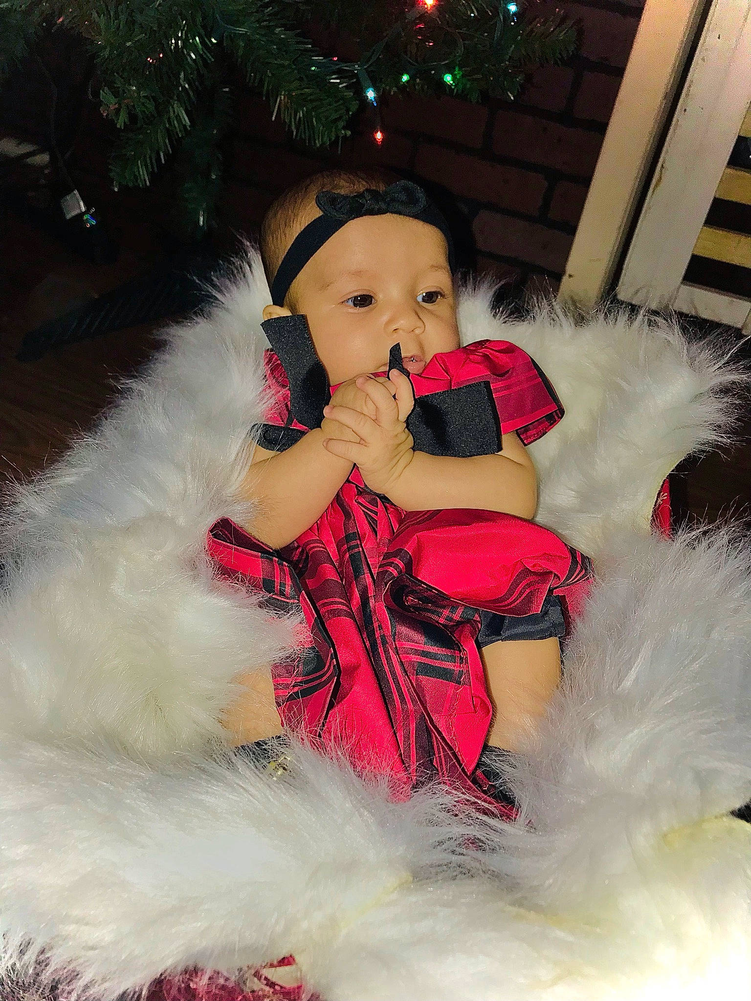 Avalynn joined the competition — help win amazing prizes! baby_toddler_clothing, christmas, christmas_decoration, christmas_tree, costume, event, fashion_design, fictional_character, fun, fur, fur_clothing, happy, hat, headwear, holiday, lap, person, pink, santa_claus, sitting