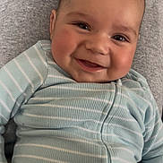 Jahkai is registered to the contest to win money with this photo: baby, smiling, face, child, infant, clothing, onesie, striped, happy, cute, portrait, person, closeup, skin, head, expression, hand, sitting, indoors, young