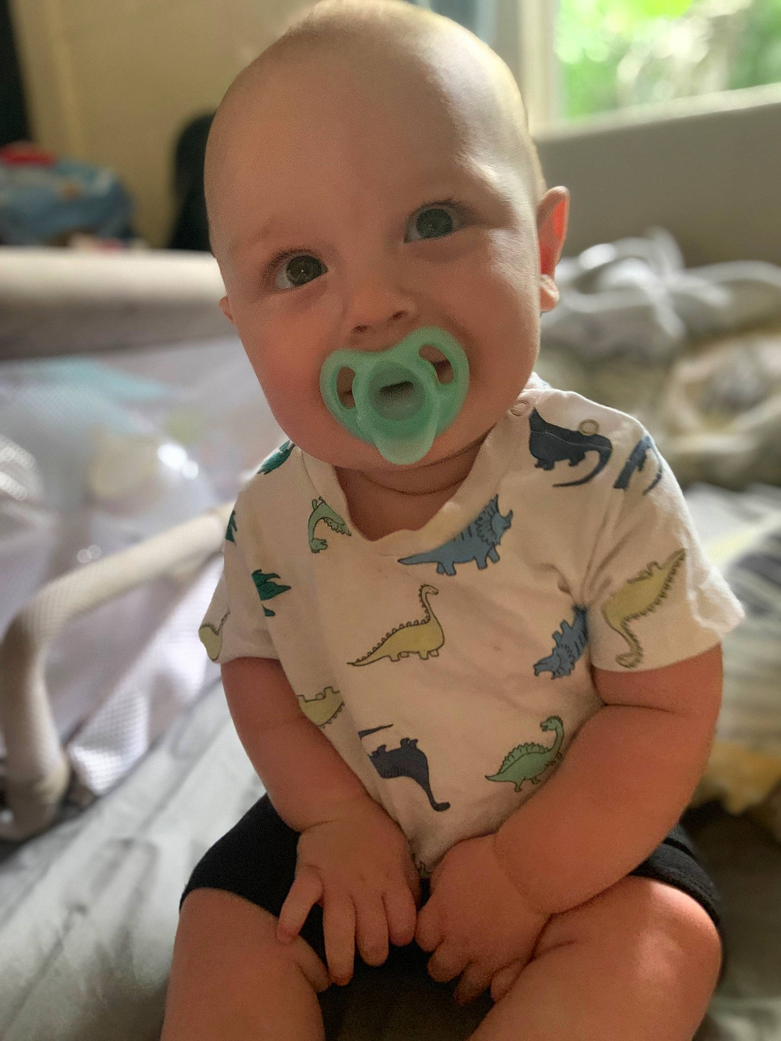 Jack is registered to the contest to win money with this photo: baby, baby_products, baby_safety, baby_toddler_clothing, cheek, child, comfort, face, flooring, fun, happy, human_leg, mouth, person, room, sitting, skin, sleeve, smile, thumb
