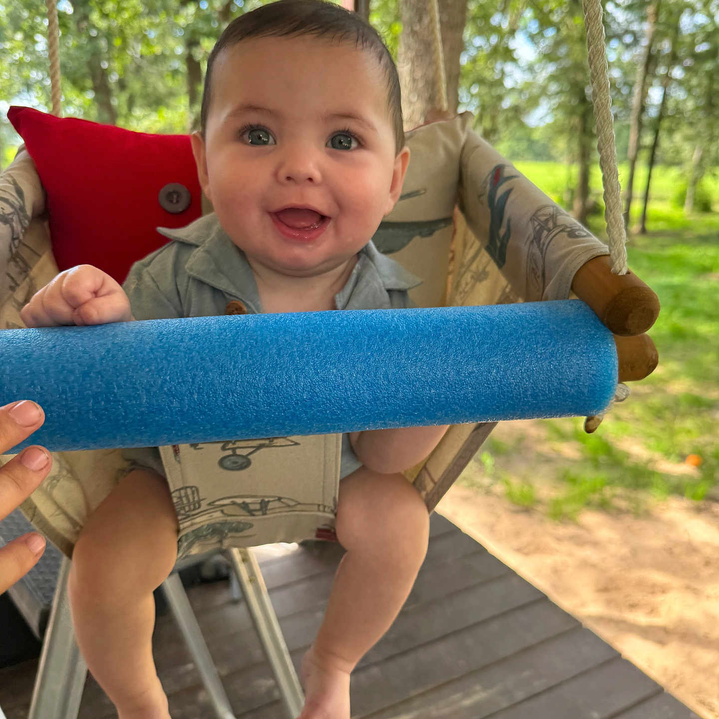 Ricky joined the competition — help win amazing prizes! baby, blue_foam, child, cute, daylight, greenery, hand, happy, infant, nature, outdoor, play, portrait, seat, smiling, summer, sunlight, swing, trees, wooden_floor
