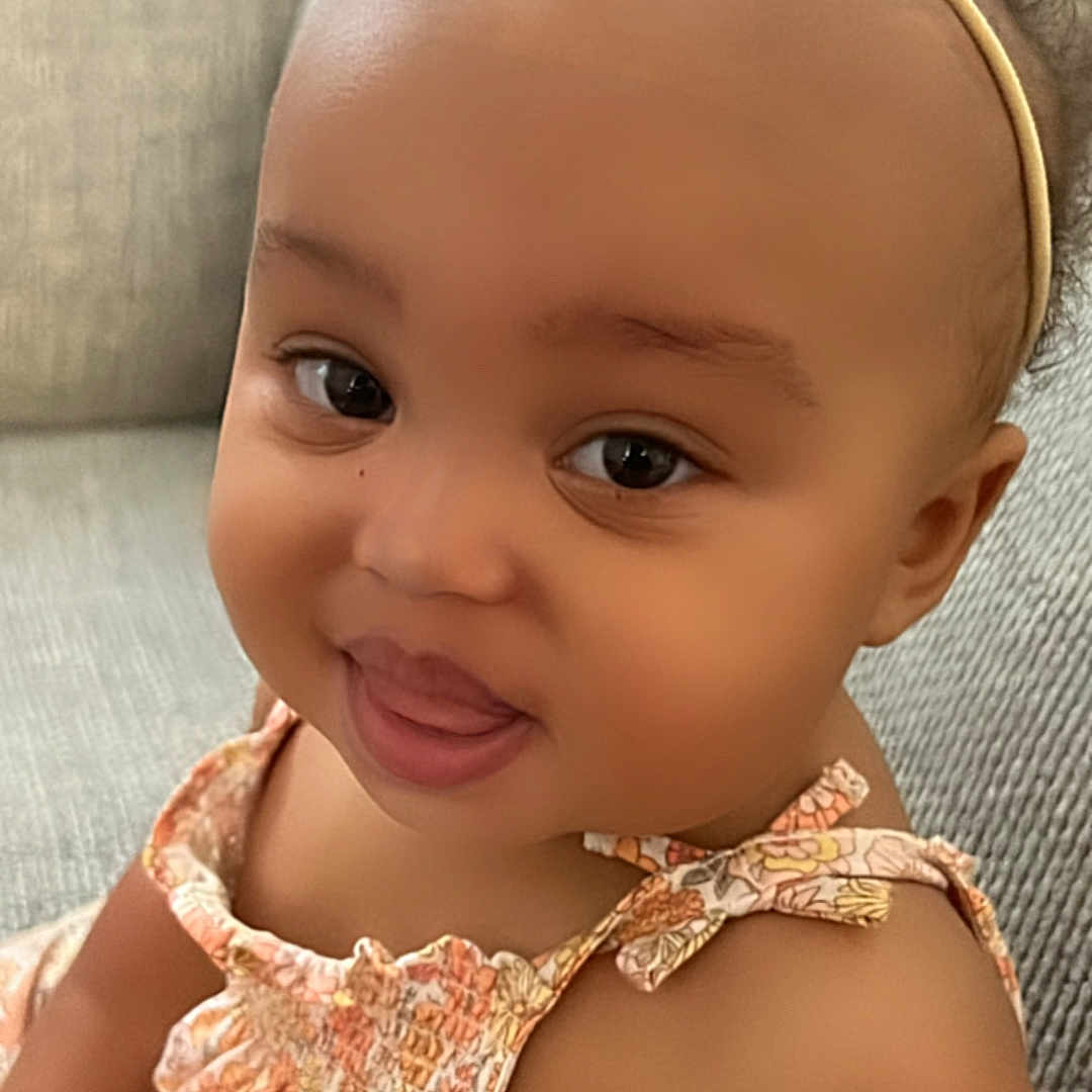 Daylanna joined the competition — help win amazing prizes! accessories, baby, bodypart, clothing, couch, cushion, dress, face, finger, furniture, hand, happy, hat, head, headband, homedecor, person, photography, portrait, smile