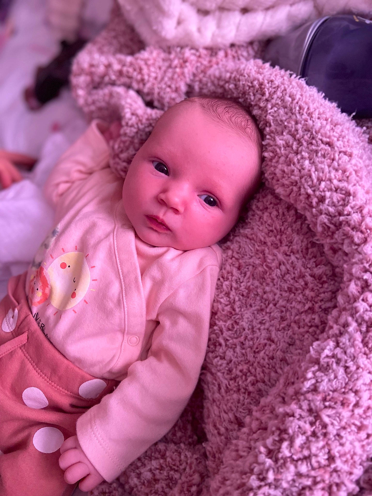 Lexie is registered to the contest to win money with this photo: baby, baby_toddler_clothing, beanie, cap, cheek, comfort, doll, eyelash, knit_cap, lip, magenta, person, pink, purple, skin, sleeve, textile, toddler, toy, wool