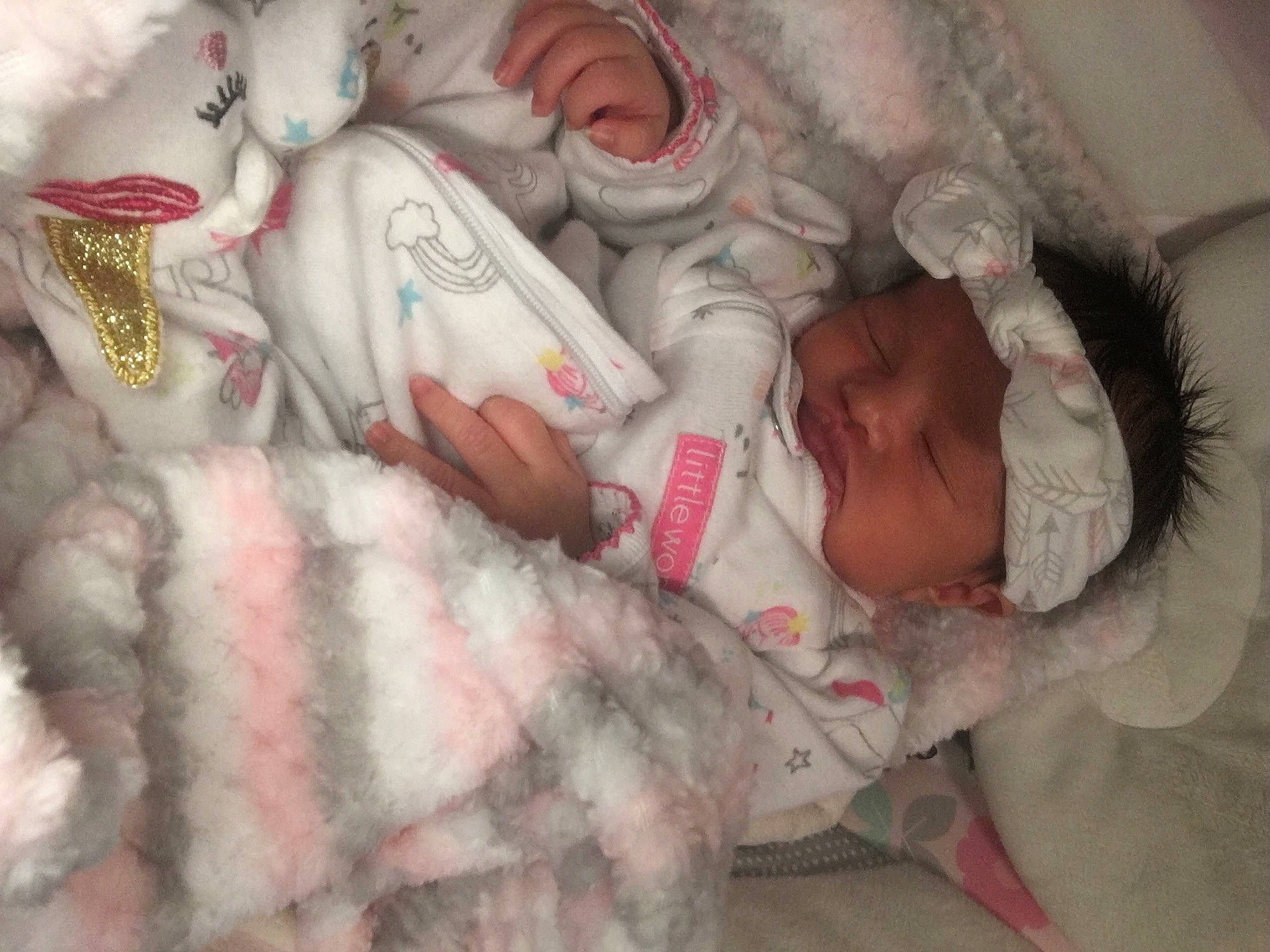 Amaya is registered to the contest to win money with this photo: art, baby, baby_products, baby_sleeping, bed, bedding, bedtime, carmine, child, comfort, eye, flesh, fur, headwear, linens, pattern, person, pink, room, skin