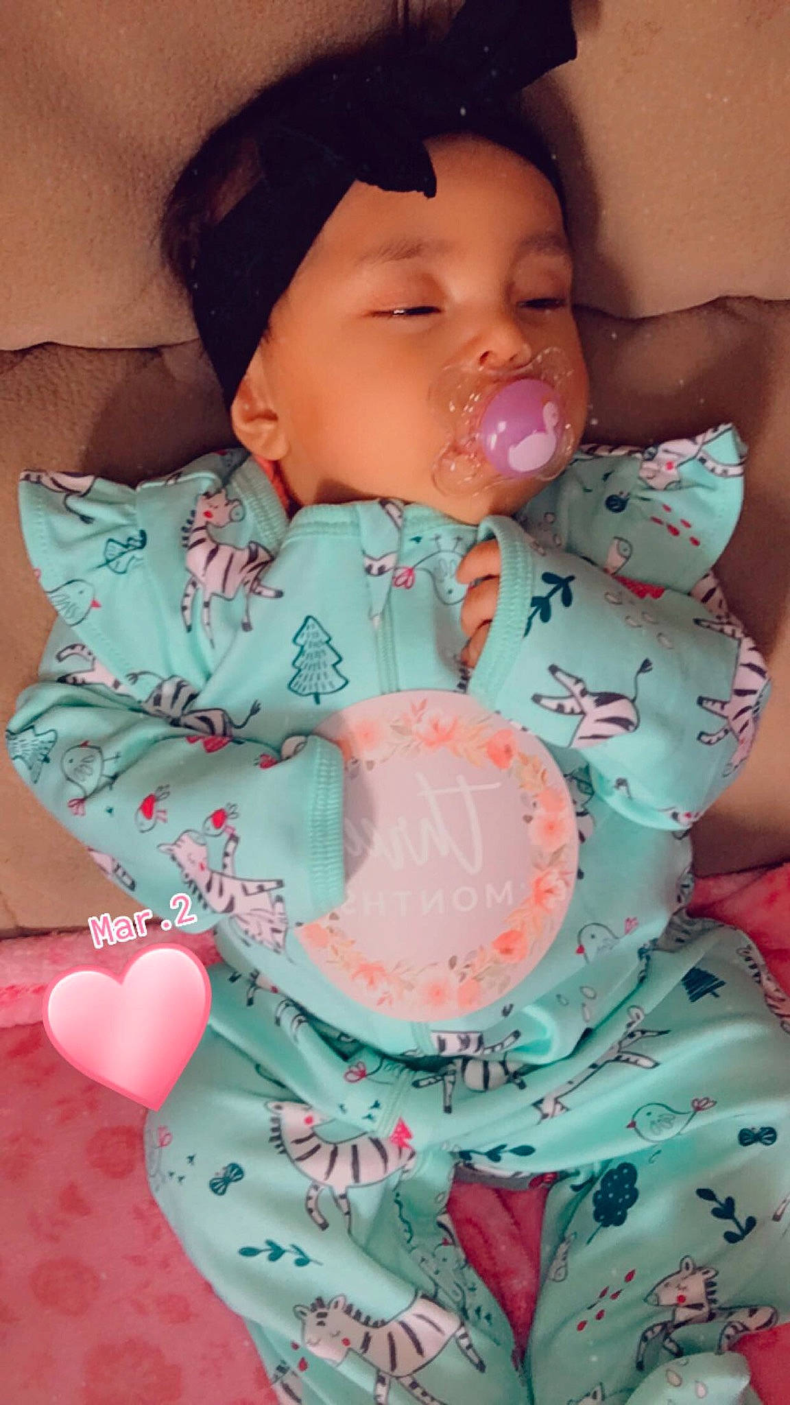 Amaya is registered to the contest to win money with this photo: aqua, baby, baby_sleeping, baby_toddler_clothing, cheek, comfort, dress, face, happy, headwear, human_body, lip, mouth, nail, neck, pattern, person, pink, skin, sleeve