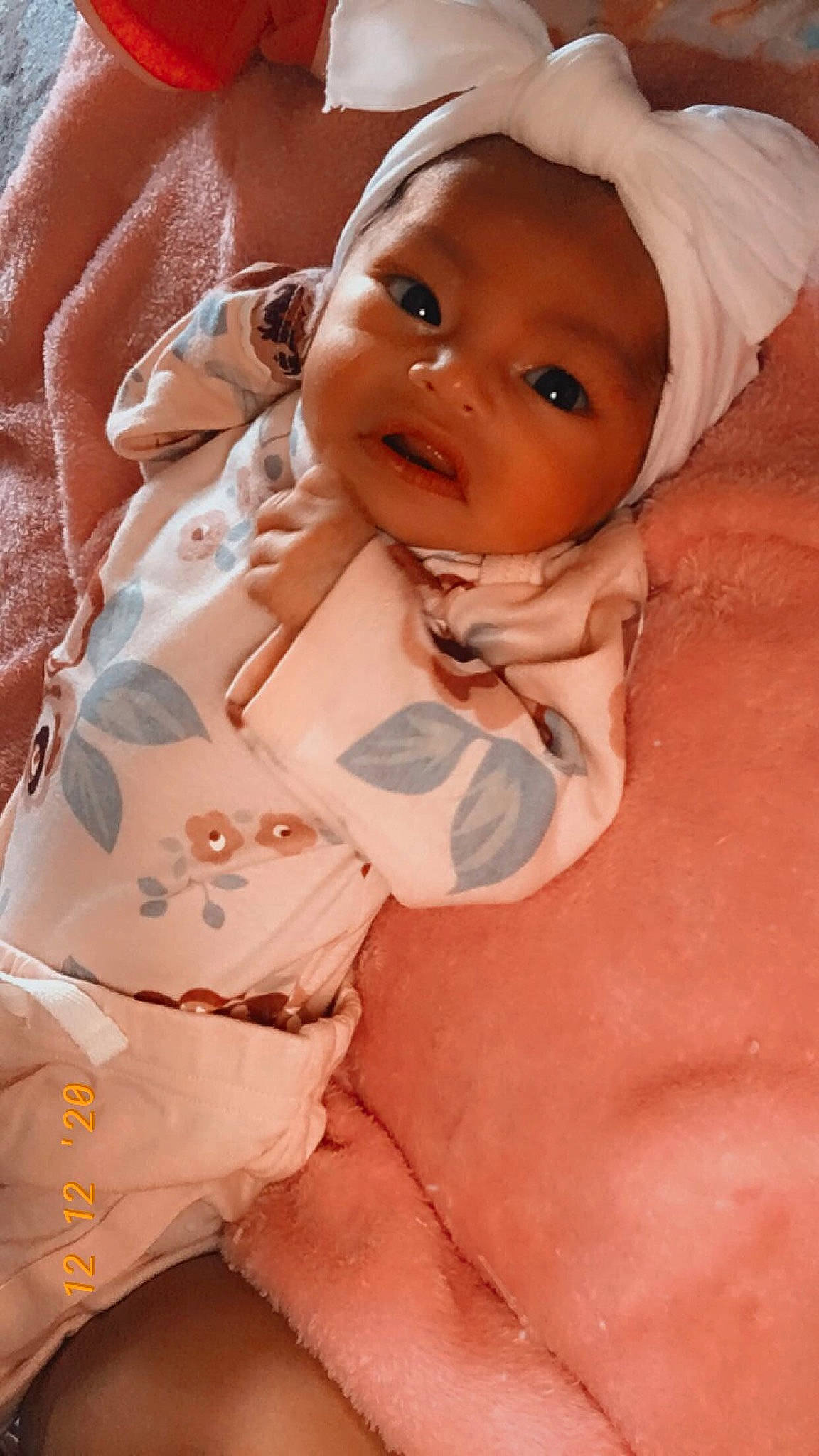 Amaya is registered to the contest to win money with this photo: baby, baby_toddler_clothing, cheek, chin, comfort, eye, eyebrow, face, finger, gesture, happy, head, headwear, lip, mouth, nose, person, pink, skin, sleeve