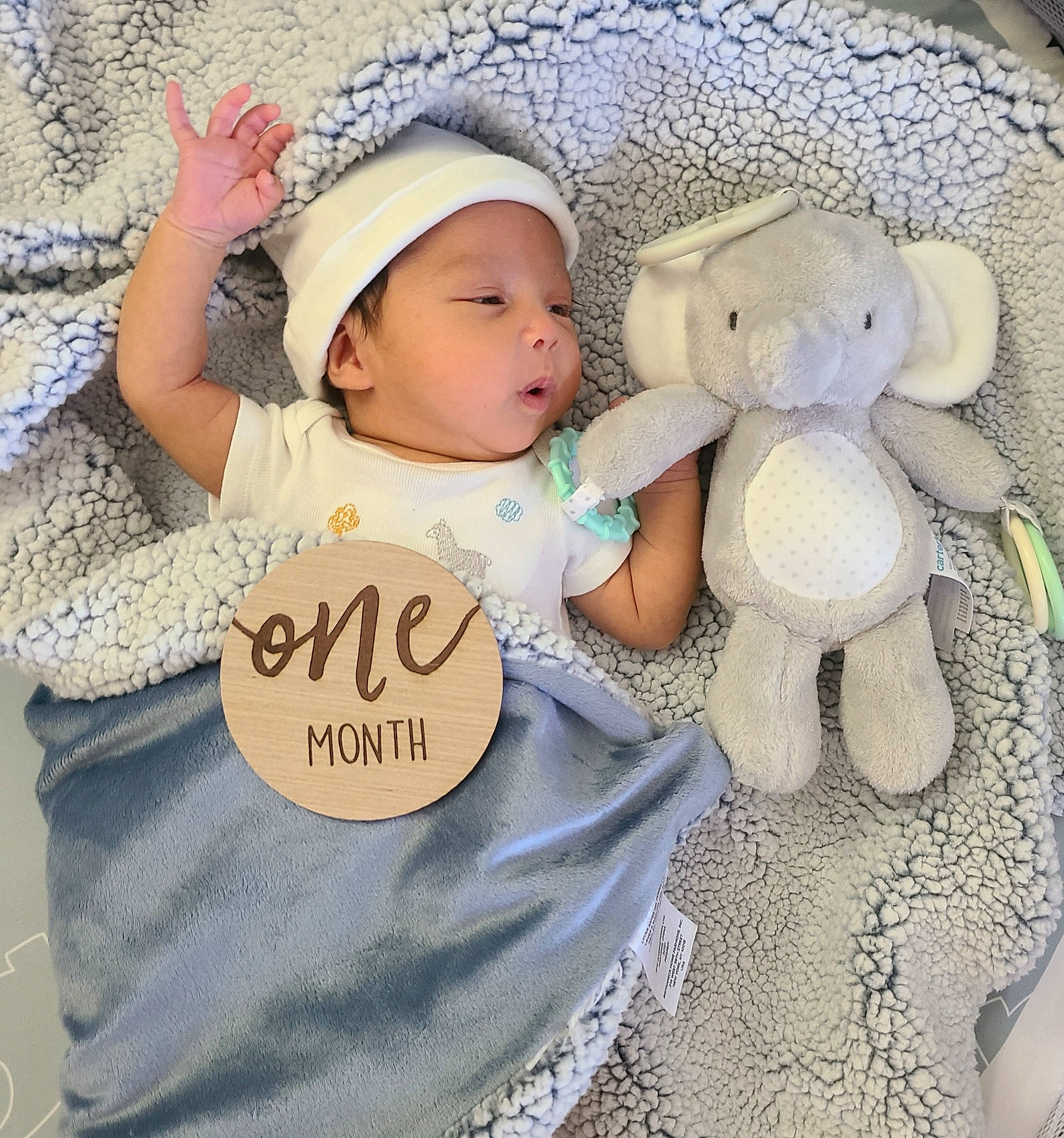Evan is registered to the contest to win money with this photo: baby, baby_products, baby_sleeping, baby_toddler_clothing, cap, child, comfort, fashion_accessory, font, happy, headgear, headwear, pattern, person, plush, skin, sleeve, stuffed_toy, sun_hat, textile