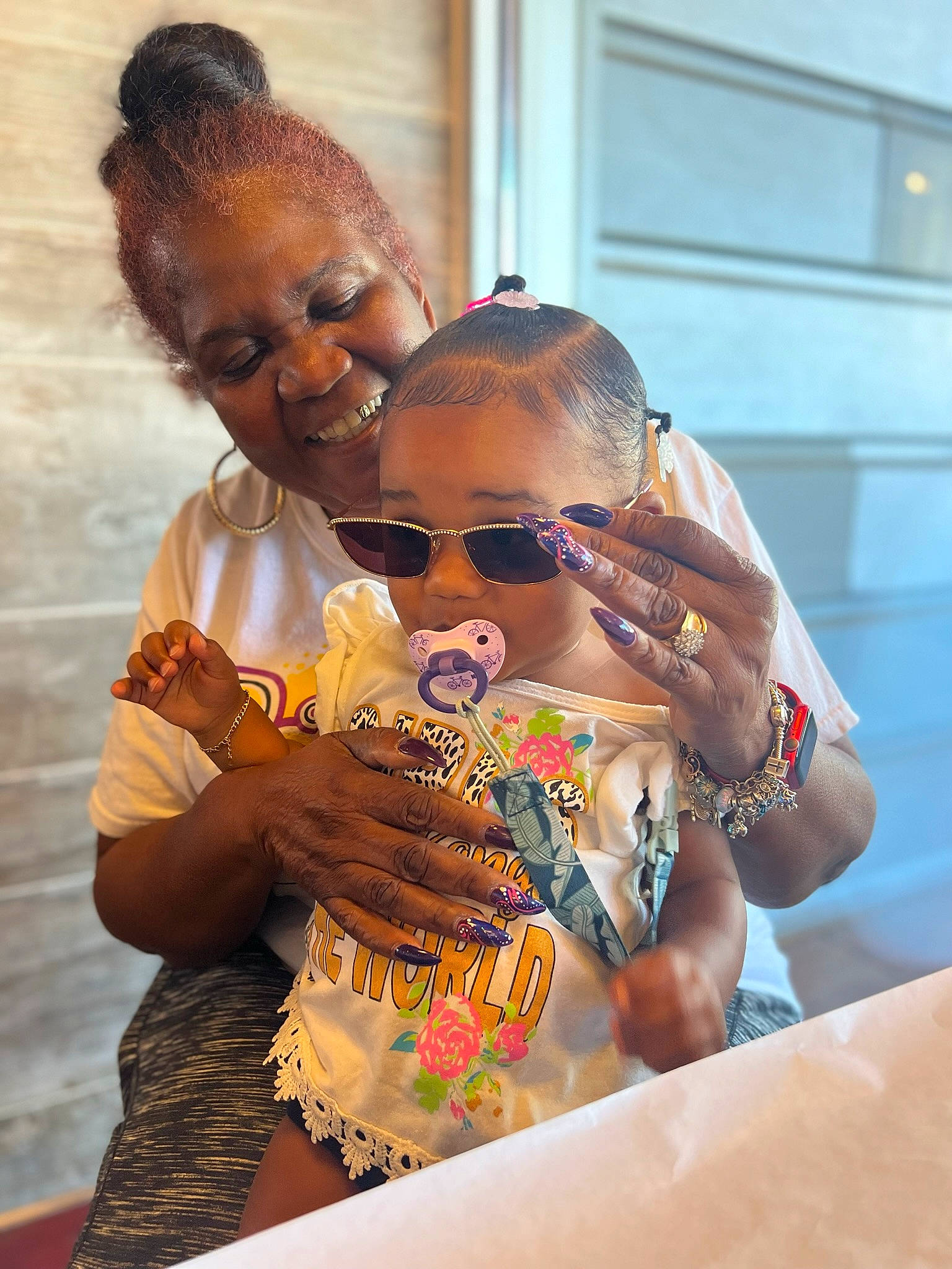 Annie-michelle is registered to the contest to win money with this photo: baby, child, drinking, event, eyewear, fun, goggles, hand, happy, joy, leisure, mouth, nail, person, personal_protective_equipment, recreation, skin, sunglasses, t_shirt, table
