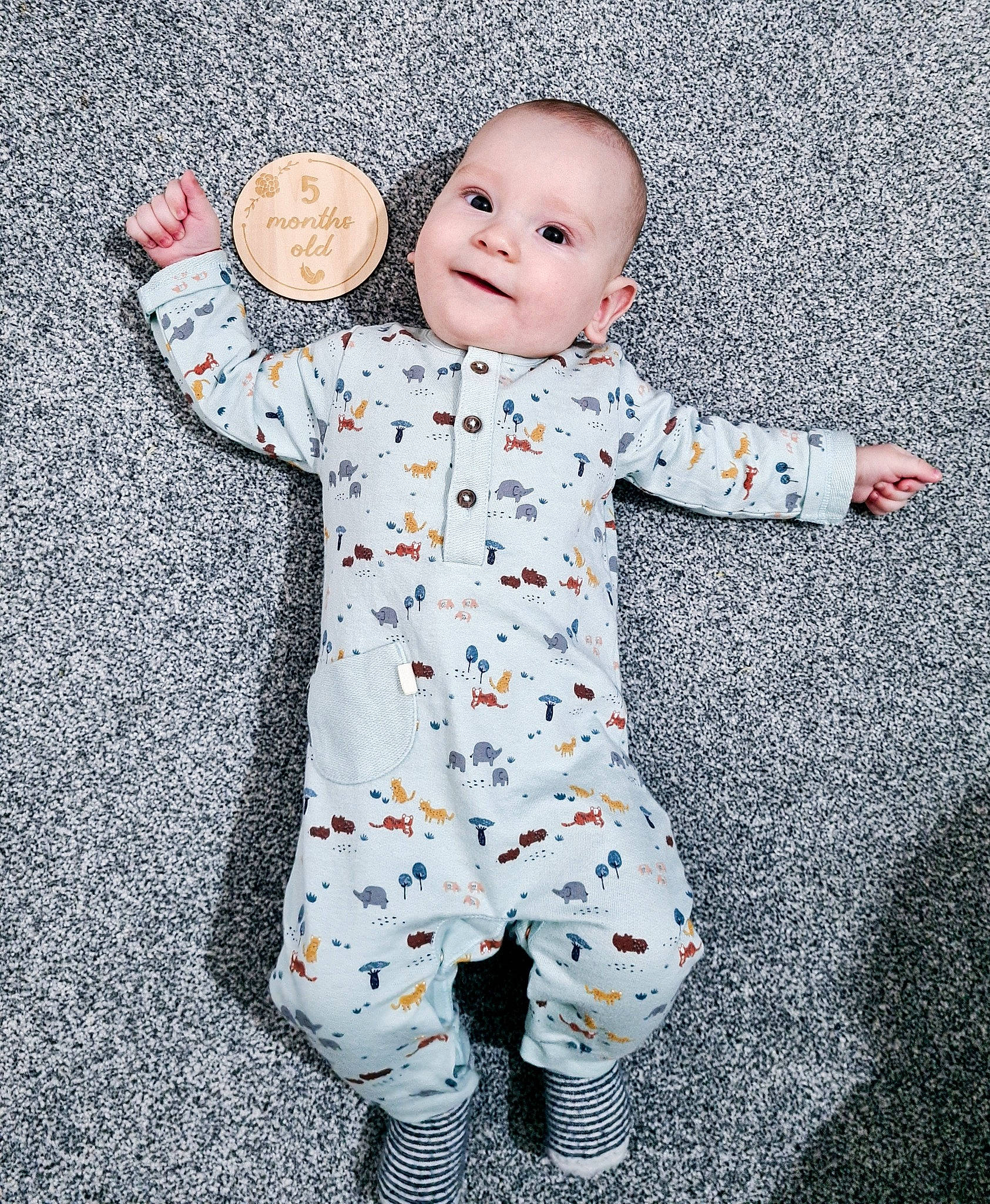 Rares is registered to the contest to win money with this photo: baby, baby_laughing, baby_toddler_clothing, child, collar, face, facial_expression, fun, gesture, happy, head, pattern, people_in_nature, person, play, sleeve, smile, textile, toddler, white