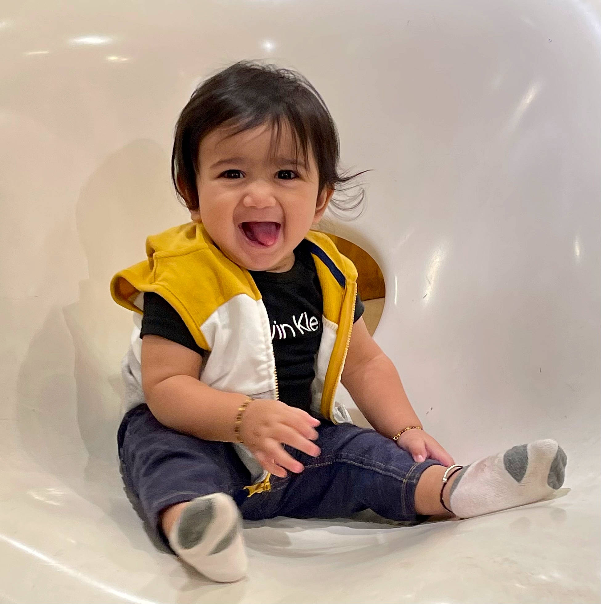 Divith is registered to the contest to win money with this photo: baby_toddler_clothing, ball, child, eye, face, finger, flooring, fun, happy, human_leg, knee, leg, person, recreation, skin, sleeve, smile, sportswear, t_shirt, thumb