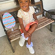 Jayana joined the competition — help win amazing prizes! bench, child, clothing, face, female, footwear, furniture, girl, hair, head, person, photography, portrait, racket, sandal, shoe, shorts, sitting, sleeve, sneaker