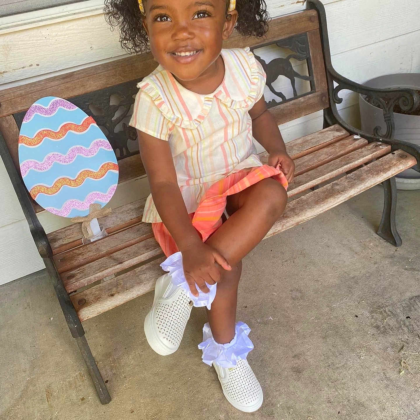 Jayana joined the competition — help win amazing prizes! bench, child, clothing, face, female, footwear, furniture, girl, hair, head, person, photography, portrait, racket, sandal, shoe, shorts, sitting, sleeve, sneaker