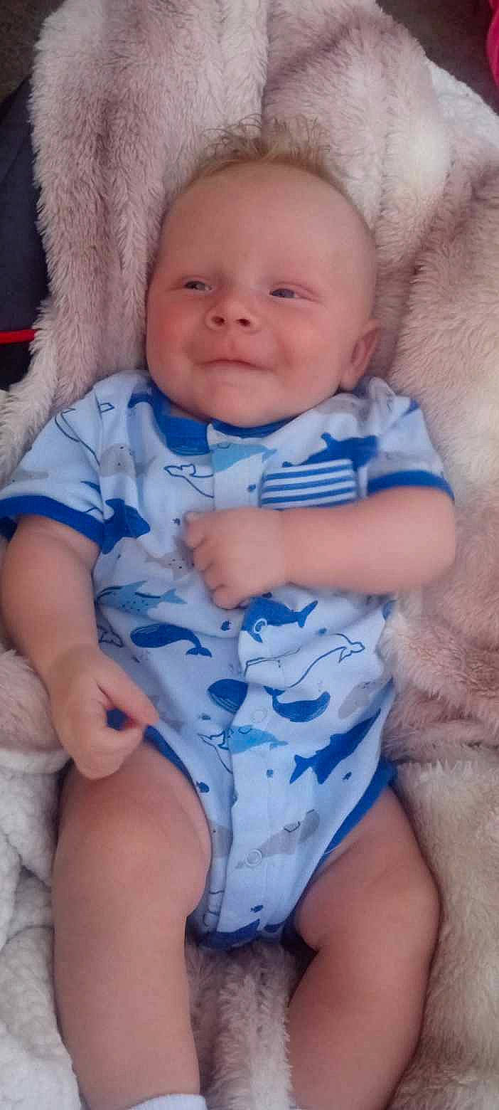 Landin is registered to the contest to win money with this photo: azure, baby_toddler_clothing, cheek, chin, eye, eyebrow, face, head, iris, lip, mouth, muscle, neck, nose, organ, person, skin, sleeve, smile, stomach