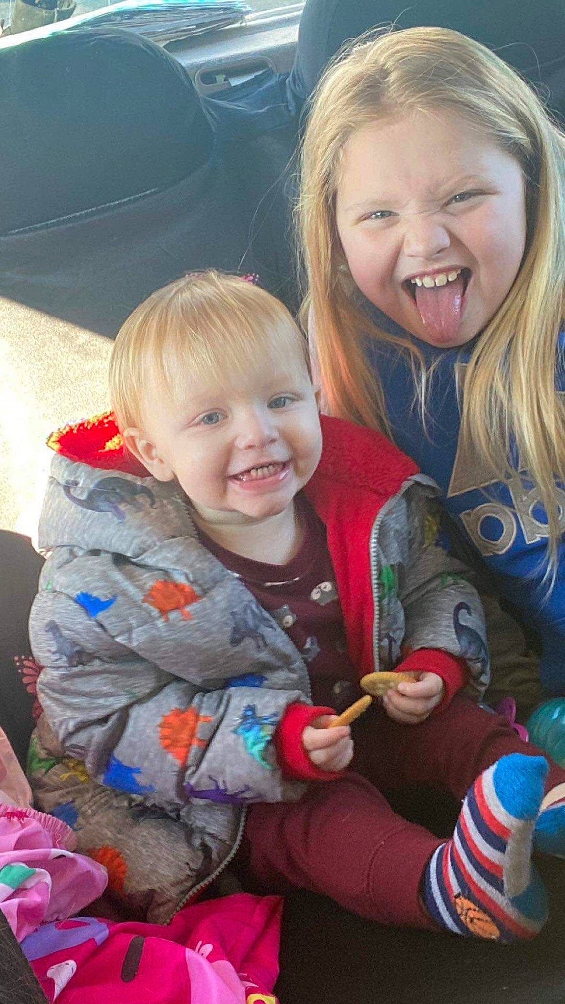 Jaxson is registered to the contest to win money with this photo: baby, baby_toddler_clothing, child, eye, face, facial_expression, fun, grass, hairstyle, happy, head, human_body, interaction, iris, joy, lap, organ, person, skin, smile