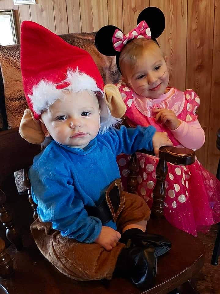 Braxton is registered to the contest to win money with this photo: baby, baby_toddler_clothing, chair, child, costume_hat, event, fictional_character, fun, happy, hat, head, headwear, holiday, human_body, joy, lap, organ, person, pink, santa_claus