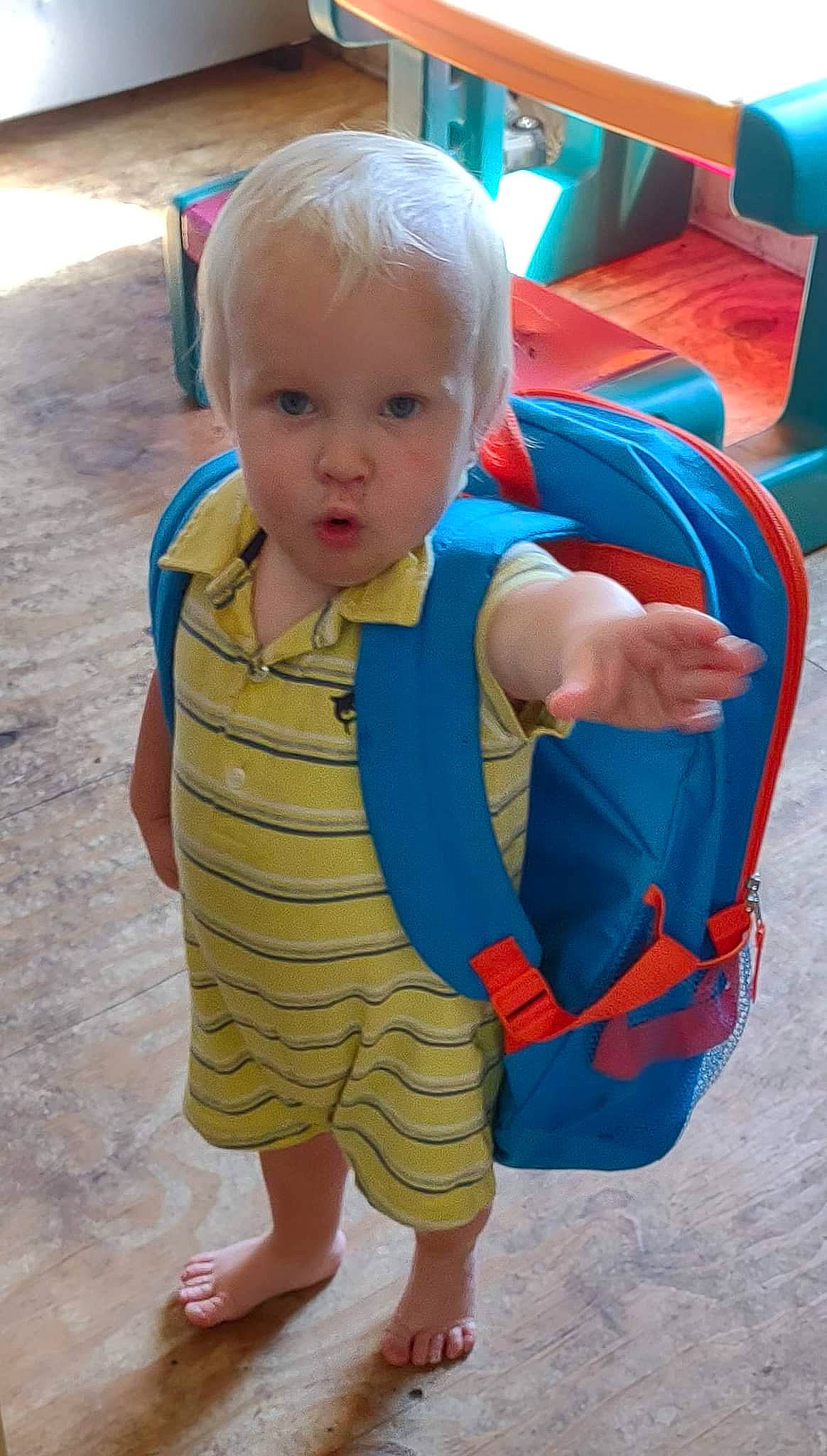 Samual is registered to the contest to win money with this photo: baby, baby_toddler_clothing, barefoot, blue, child, electric_blue, flooring, foot, fun, head, human_leg, leisure, pattern, person, play, recreation, sitting, skin, sleeve, thumb