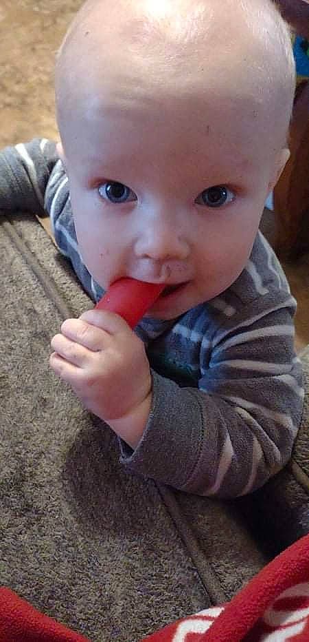 Samual joined the competition — help win amazing prizes! baby, baby_toddler_clothing, biting, cheek, child, ear, eye, finger, gesture, grass, hand, iris, lip, mouth, nail, nose, person, skin, sleeve, thumb