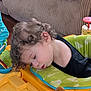 Lucas joined the competition — help win amazing prizes! toddler, child, curly_hair, sleeping, baby_activity_center, toys, indoor, face, head, clothing, couch, furniture, colorful, playtime, young_child, resting, cute, infant, closeup, home