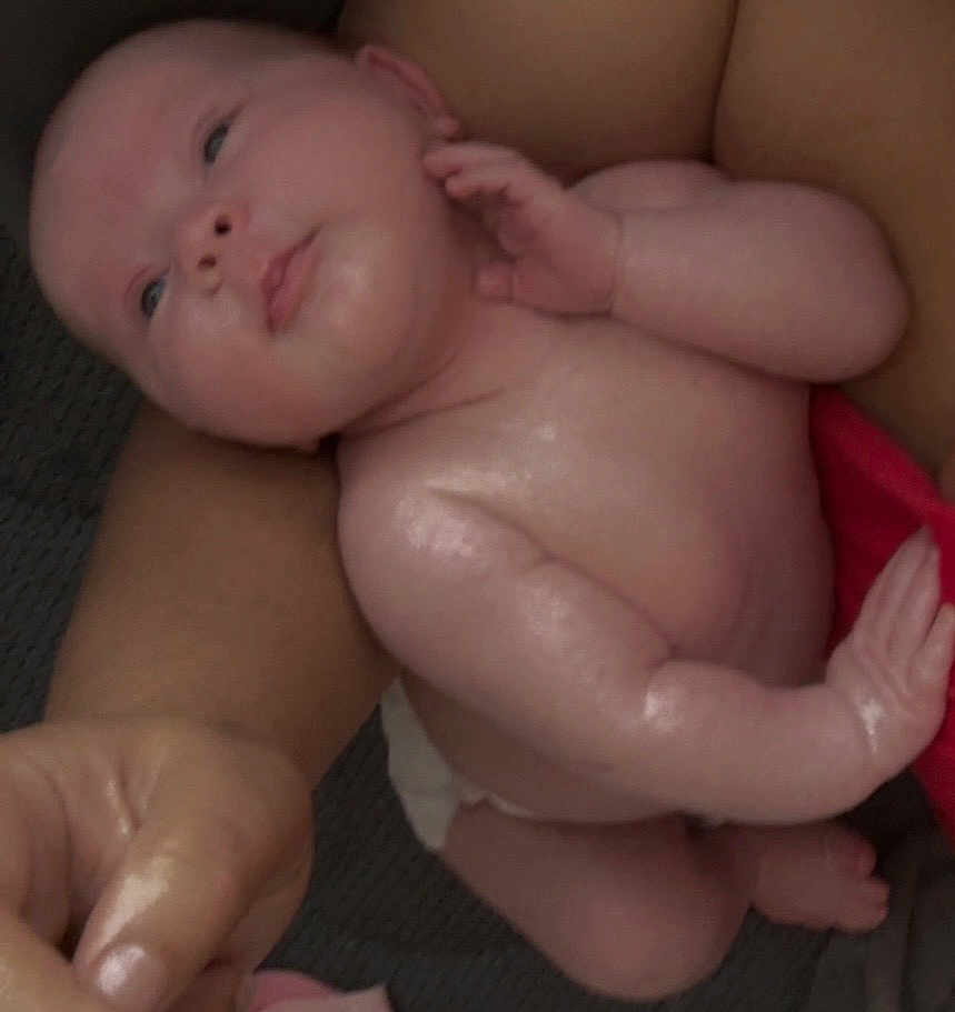 Anjilina joined the competition — help win amazing prizes! baby, infant, skin, arm, hand, diaper, red_cloth, person, closeup, naked_torso, newborn, cute, chubby, resting, indoor, soft_skin, baby_skin, human, small_hand, lying_down