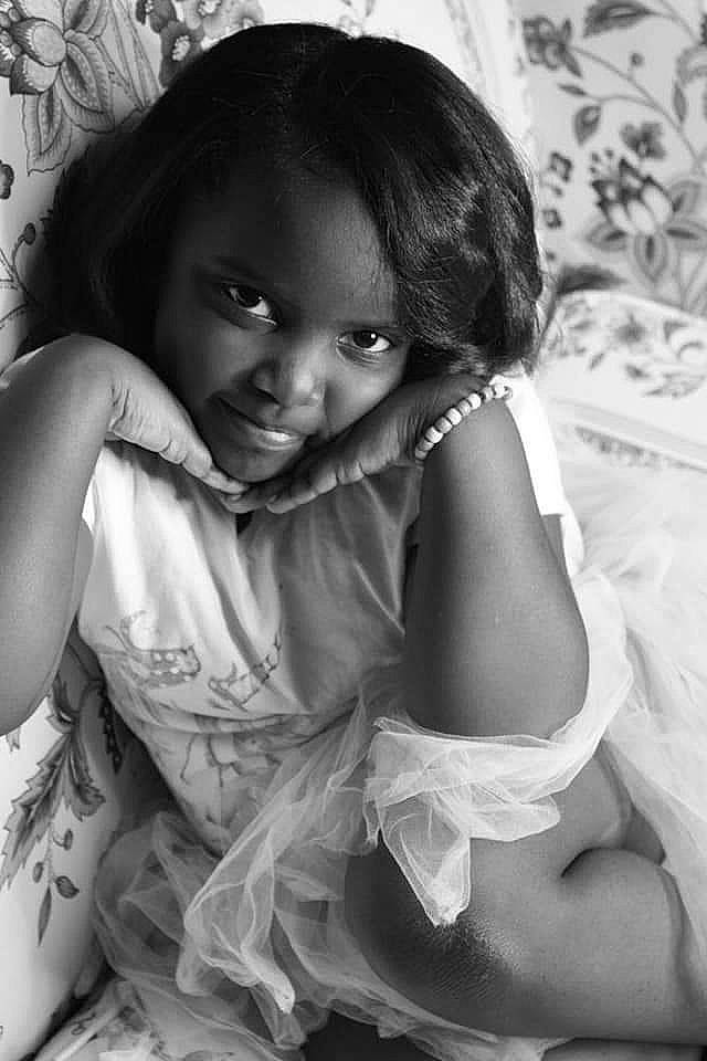 Maleah joined the competition — help win amazing prizes! arm, black, black_and_white, black_hair, cheek, eye, flash_photography, gesture, hairstyle, hand, happy, human_body, iris, muscle, person, shoulder, skin, smile, style, toddler