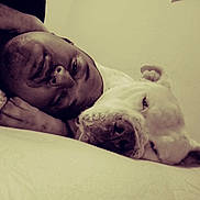 Caine Lokz Barco joined the competition — help win amazing prizes! baby, bed, bedroom, blanket, closeup, companionship, cuddling, dog, face, friendship, human, indoor, infant, lying_down, pet, portrait, sepia_tone, sleeping, soft_lighting, white_dog