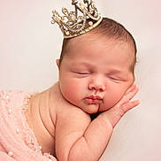 Lanelle is registered to the contest to win money with this photo: newborn, baby, sleeping, crown, pink_cloth, pearl, infant, portrait, soft_skin, cute, peaceful, resting, head, hand, closeup, adorable, sleep, baby_wrapped, tiny, child