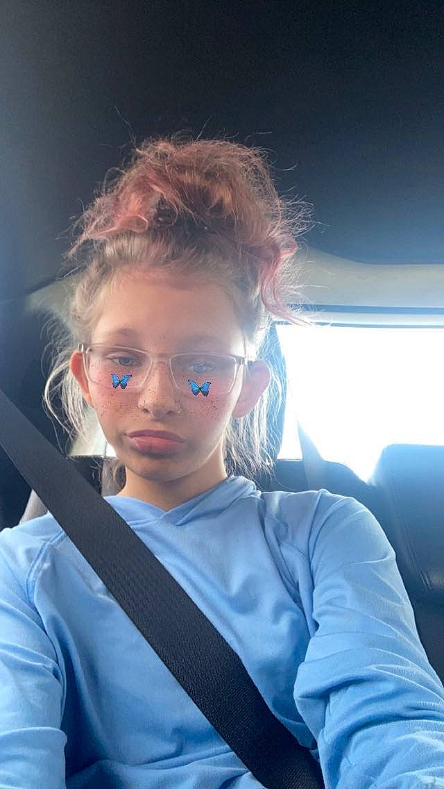 Peyton is registered to the contest to win money with this photo: blond, brown_hair, elbow, electric_blue, eyebrow, eyewear, flash_photography, fun, gesture, glasses, happy, lip, long_hair, luxury_vehicle, nose, person, shoulder, sitting, vehicle_door, vision_care