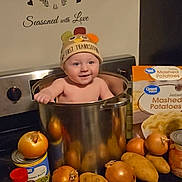 Azriel joined the competition — help win amazing prizes! baby, child, kitchen, cooking_pot, onions, potatoes, canned_food, spices, instant_mashed_potatoes, stove, hat, thanksgiving, smiling, wall_decal, indoor, food, cute, person, appliance, happy