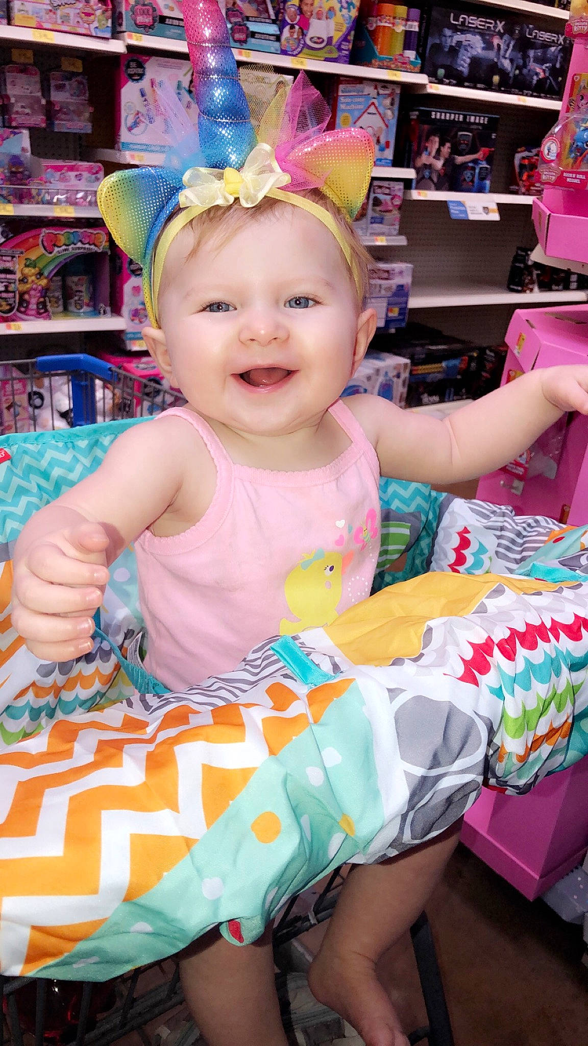 Charity is registered to the contest to win money with this photo: baby_toddler_clothing, birthday, child, ear, party, person, pink, play, toddler