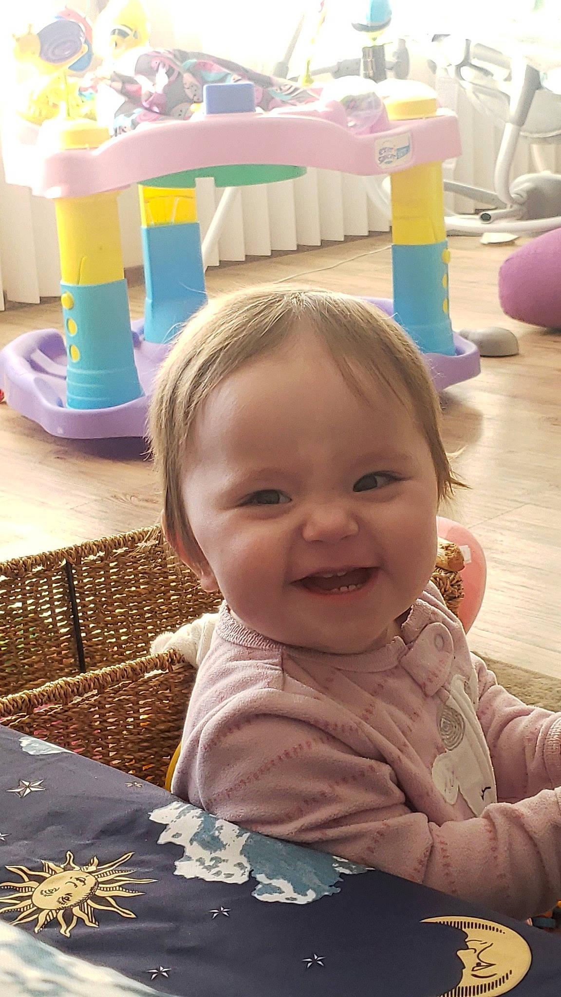 Emily is registered to the contest to win money with this photo: baby, baby_toddler_clothing, chair, cheek, child, eye, flooring, fun, happy, head, iris, joy, leisure, person, photograph, product, skin, smile, snapshot, table