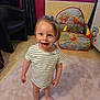 barefoot, carpet, child, curly_hair, curtains, cute, furniture, happy, home, indoor, person, play_tent, radiator, rug, smiling, striped_shirt, toddler, toy, winnie_the_pooh, young_child
