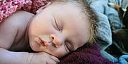 Hazel is registered to the contest to win money with this photo: baby, sleeping, blanket, soft, closeup, face, peaceful, child, infant, skin, hand, rest, cozy, cute, relax, portrait, young, comfort, nap, warm
