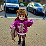 child, toddler, hat, jacket, pacifier, teddy_bear, blanket, outdoor, gravel, shoes, curious, cute, winter_clothing, standing, toy, person, young_child, street, daylight, cold_weather