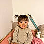 Max a rejoint le concours — aidez-le/la à gagner de superbes lots ! toddler, child, smiling, pigtails, sweater, indoor, baby, changing_table, towel, skin, face, hands, hair, room, wall, baby_care, bottle, happy, cute, infant