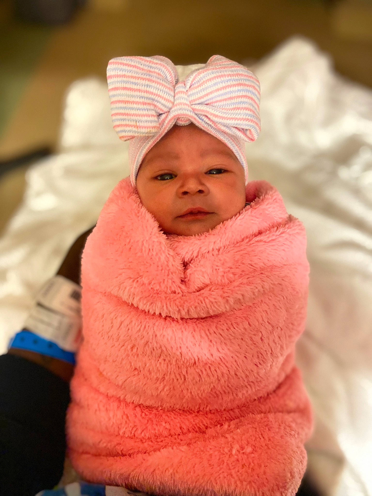 Gracelyn joined the competition — help win amazing prizes! baby, baby_products, baby_sleeping, baby_toddler_clothing, beanie, cap, cheek, chin, comfort, fashion_accessory, headgear, headwear, knit_cap, linens, magenta, peach, person, pink, sleeve, toddler