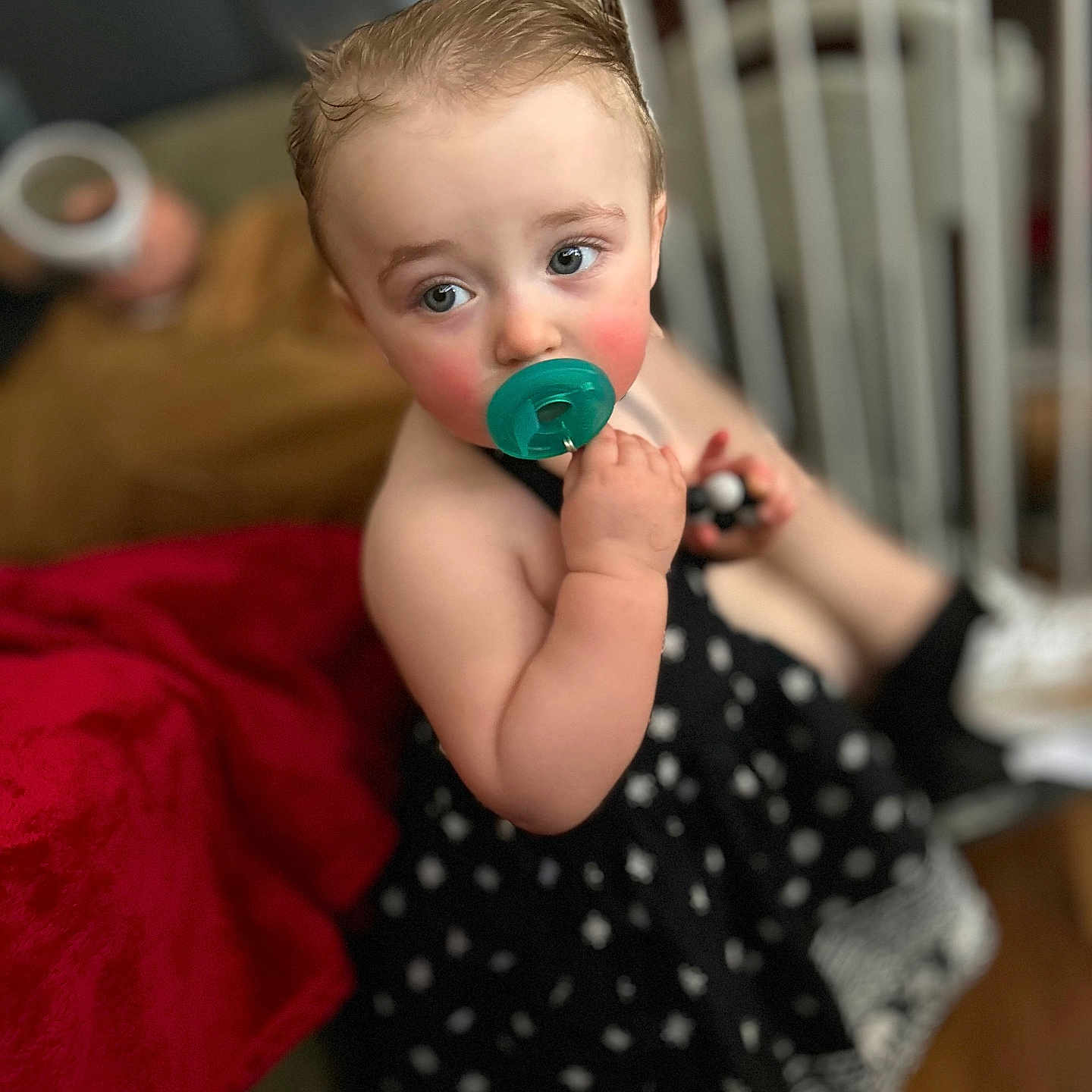 Frankie is registered to the contest to win money with this photo: baby, bodypart, clothing, couch, crib, dress, eveningdress, face, finger, formalwear, furniture, hand, head, indoors, infantbed, pattern, person, photography, portrait, sitting