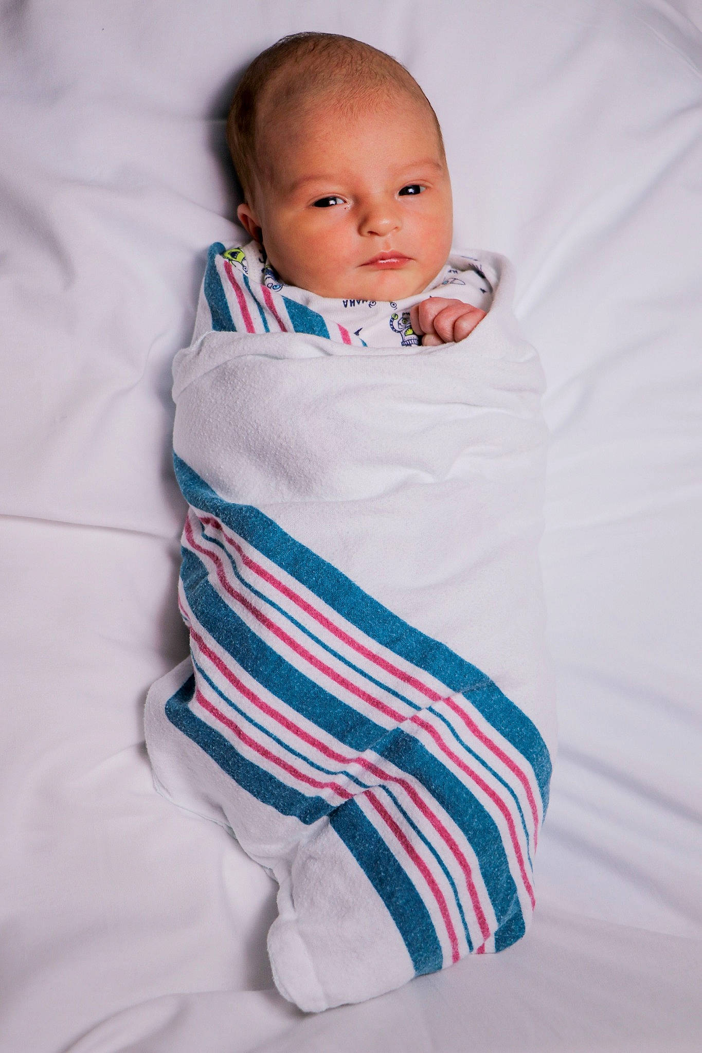 Eli joined the competition — help win amazing prizes! baby, baby_products, baby_toddler_clothing, blanket, blue, cheek, child, face, head, linens, person, product, skin, sleeve, smile, textile, toddler, white