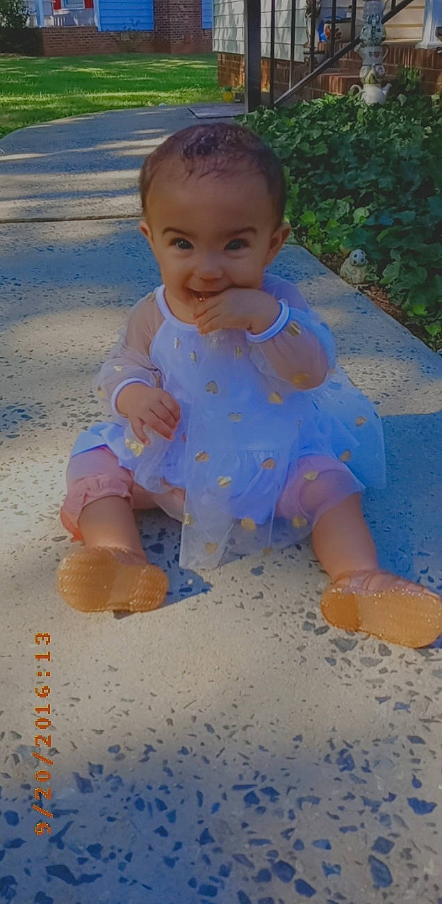 Talia is registered to the contest to win money with this photo: baby, baby_grabbing_for_something, baby_laughing, baby_products, baby_toddler_clothing, cheek, child, facial_expression, foot, joy, mouth, nose, people_in_nature, person, play, sand, summer, toddler