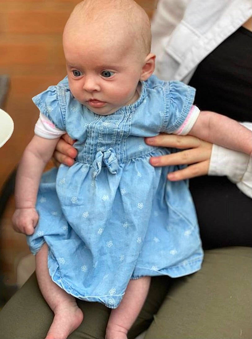 Darcey is registered to the contest to win money with this photo: azure, baby, baby_toddler_clothing, cheek, child, electric_blue, eye, finger, gesture, hairstyle, hand, happy, iris, joint, neck, person, shoulder, skin, sleeve, textile