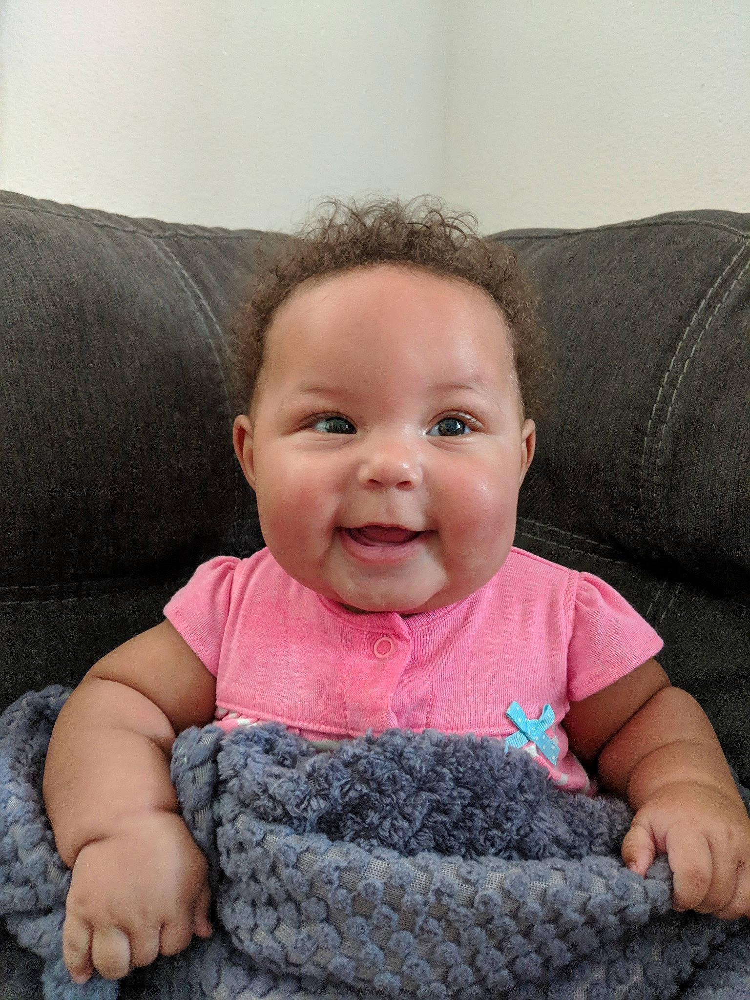 Jada joined the competition — help win amazing prizes! baby, cheek, child, chin, ear, eye, face, facial_expression, finger, hand, head, lip, mouth, nose, person, pink, sitting, skin, smile, toddler