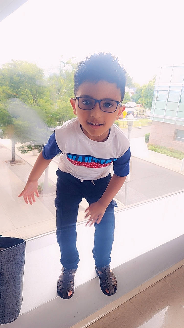 Dominick Jeonarine is registered to the contest to win money with this photo: baby_toddler_clothing, child, cool, denim, electric_blue, eyewear, fun, glasses, happy, joy, leisure, person, personal_protective_equipment, recreation, sandal, sleeve, standing, sunglasses, t_shirt, toddler